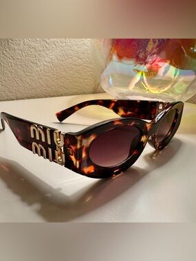 MIU MIU Sunglasses AE MU09 Oval Frame Tortoiseshell Womens 55 mm Gold Logo Arms